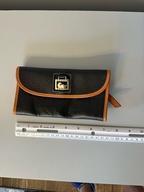 Dooney & Bourke Black Wallet with Tan Trim and Gold Logo